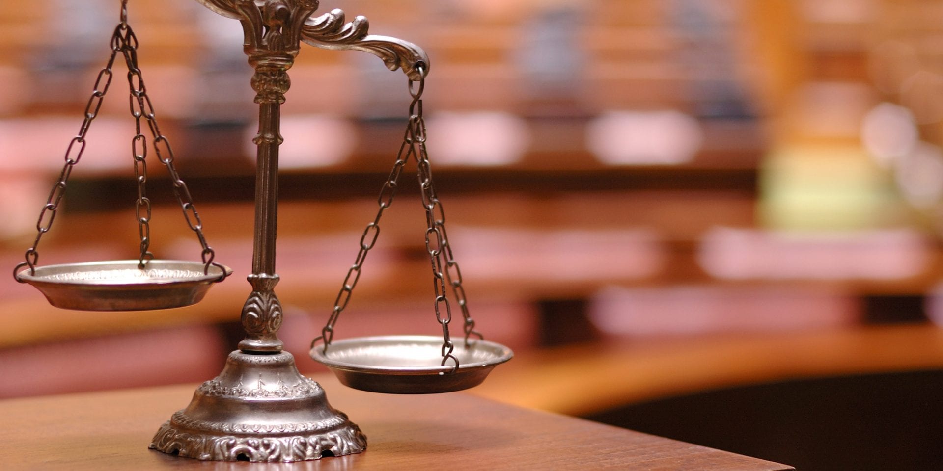 California Jury Trials Suspended, Decorative Scales of Justice in the Courtroom, Symbol of law and justice in the empty courtroom, law and justice concept