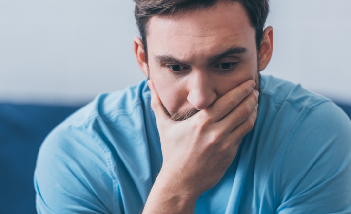 How Much Does a DUI Really Cost? stressed man with hand over mouth