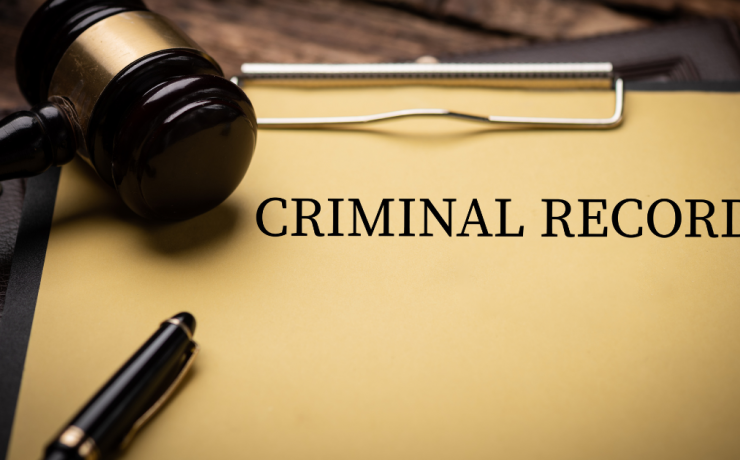 Can Federal Charges Be Expunged from Your Record? - cover sheet of file on clipboard with Criminal Record as a title and with gavel lying on top