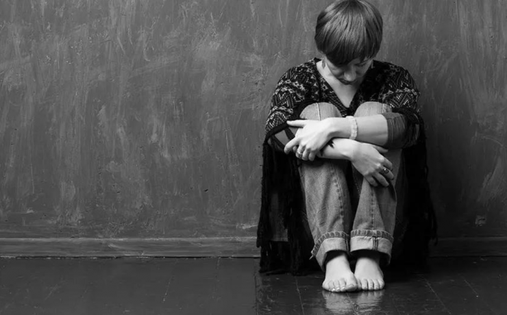 New Law: Child Trafficking Added to 3 Strikes List - photo of young person huddled on floor in front of wall