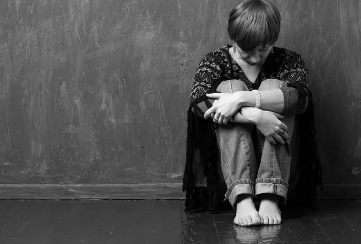 New Law: Child Trafficking Added to 3 Strikes List - photo of young person huddled on floor in front of wall