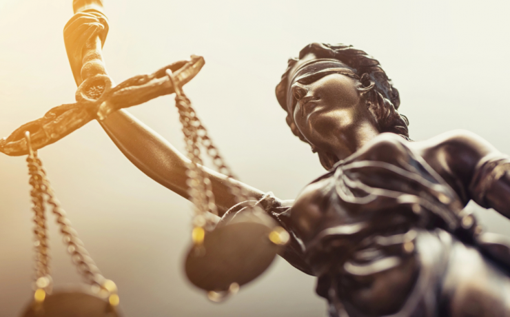 What Does Blind Justice Mean? statue of Lady Justice blindfolded and holding scales