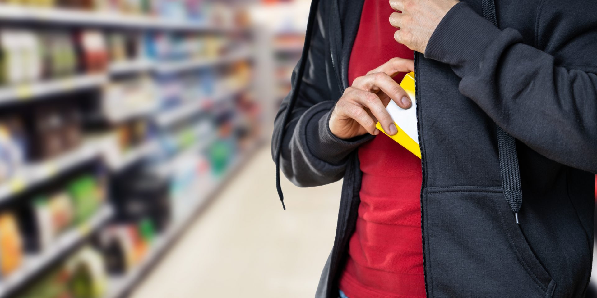 Retail Shoplifting. Man Stealing In Supermarket. Theft At Shop