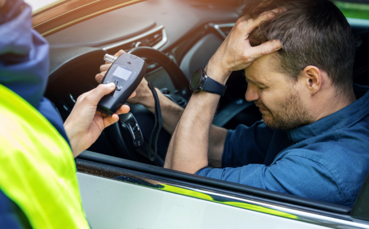 Do I Need a Lawyer for My Fresno DUI Case? A man pulled over by cop is distraught that he must take a breathalyzer test