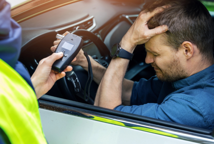 Do I Need a Lawyer for My Fresno DUI Case? A man pulled over by cop is distraught that he must take a breathalyzer test